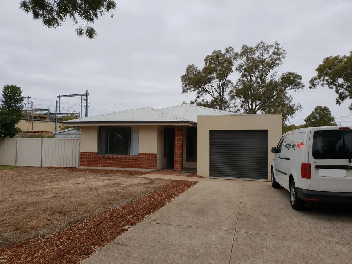 Garage door service on a residential street in Beckenham, Perth WA